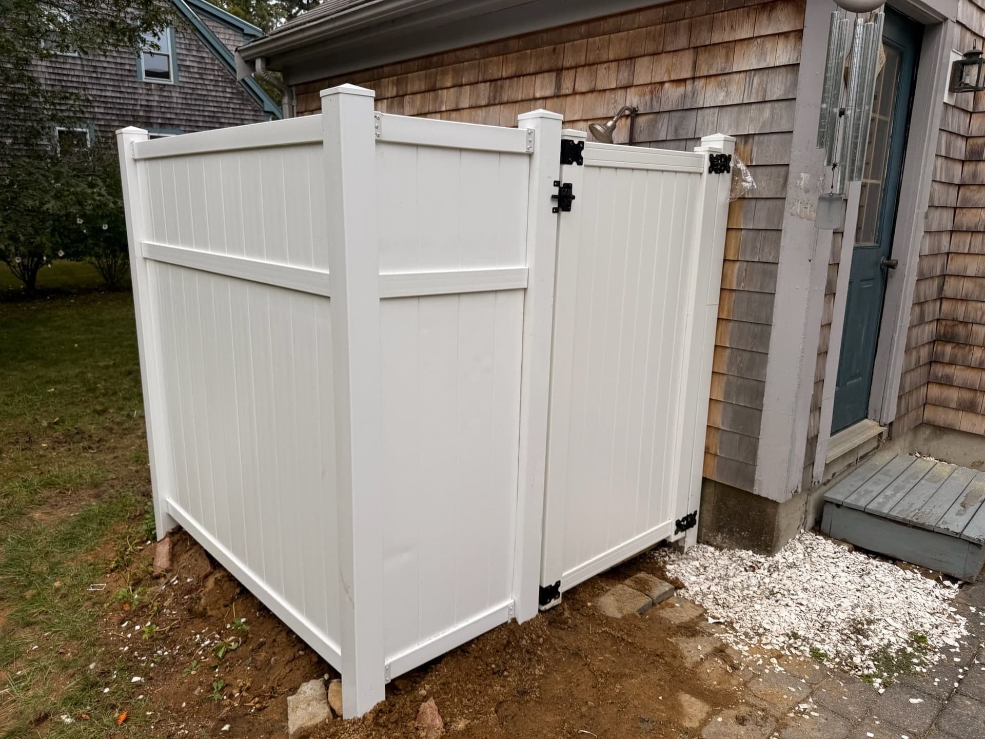 Outdoor Vinyl Shower Integration Enhances Home image