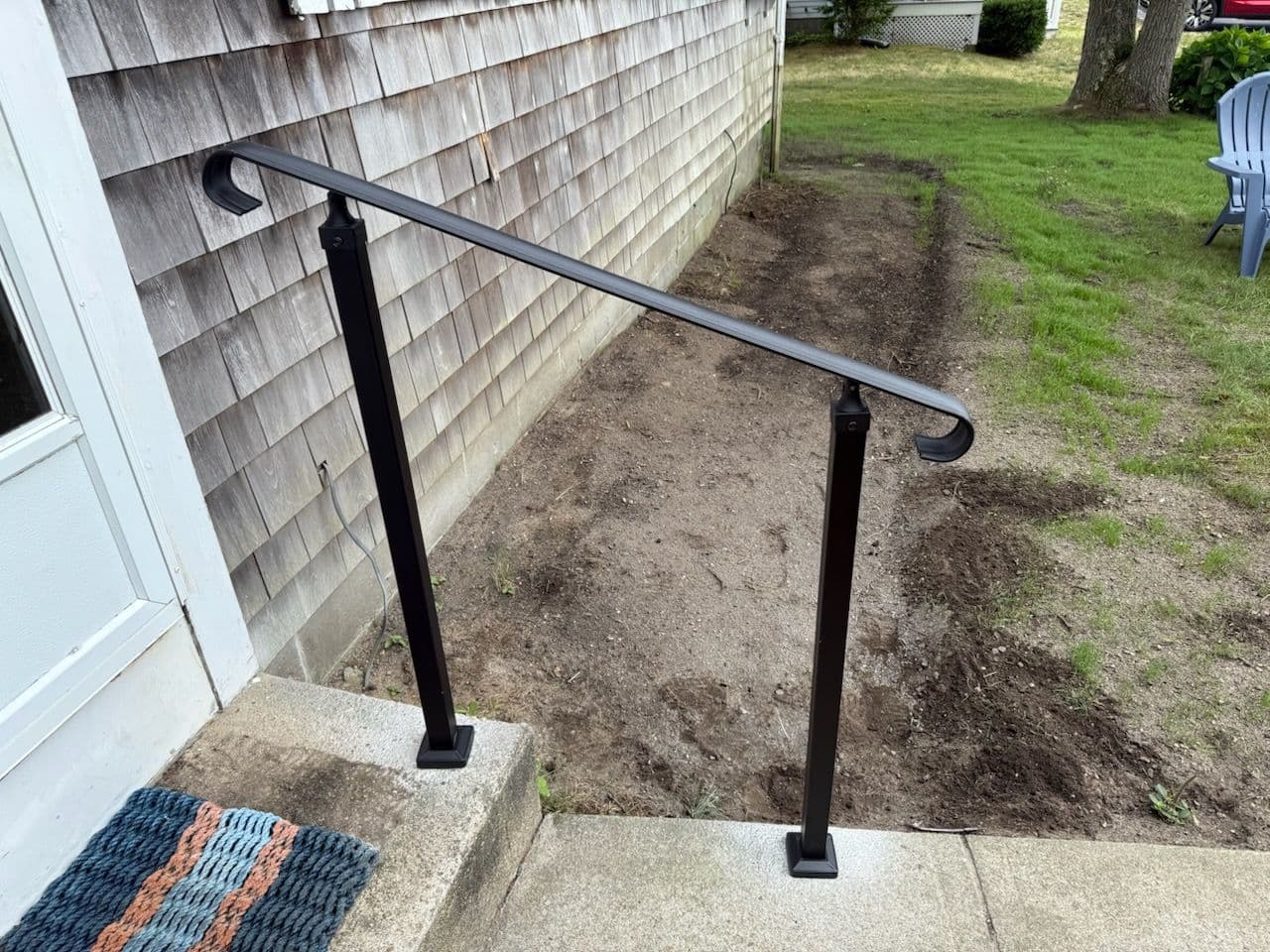 Sleek Metal Handrail Enhances Concrete Steps image